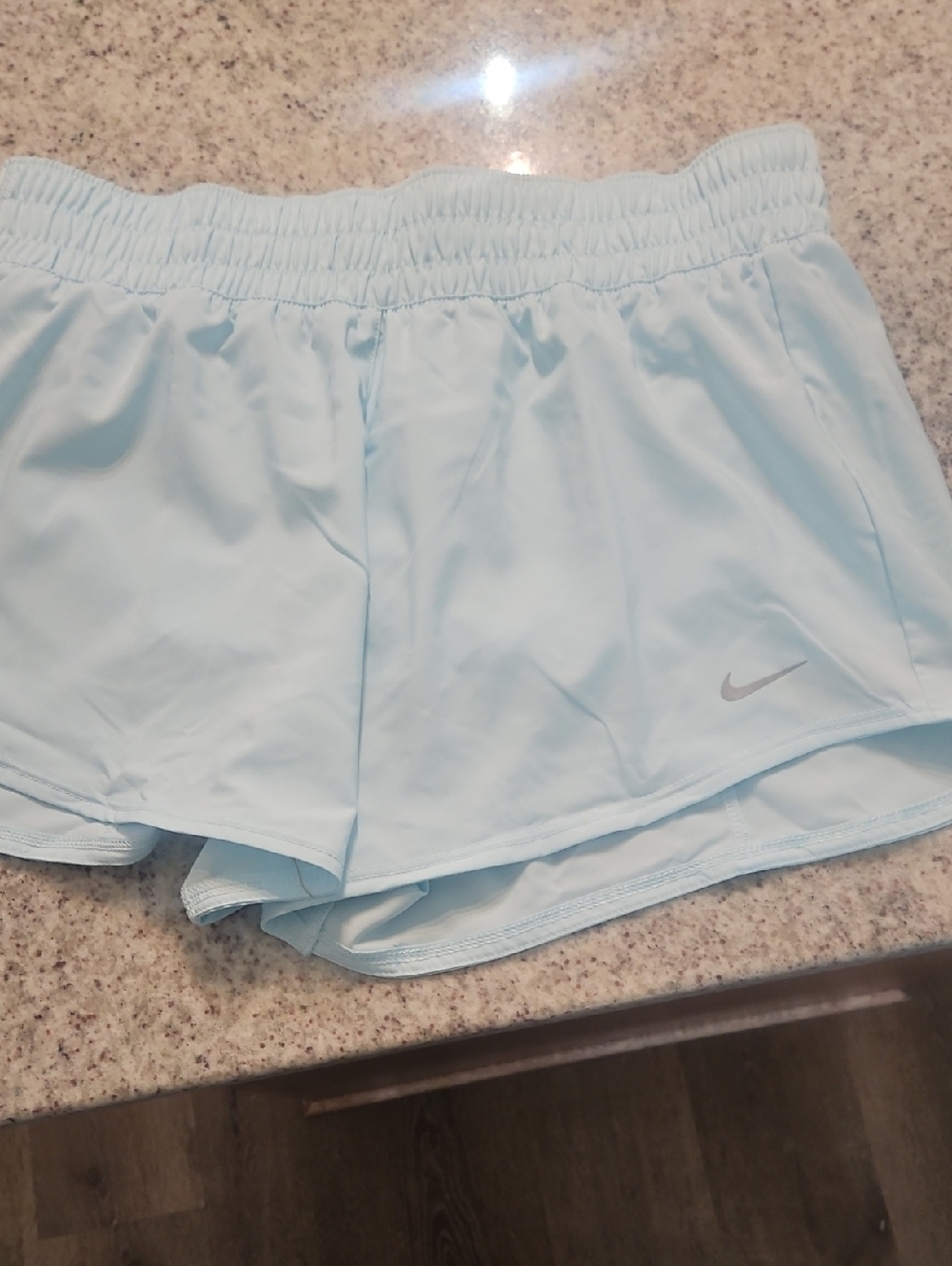 Nike Women's Pale Blue Running Shorts with Reflective Swoosh